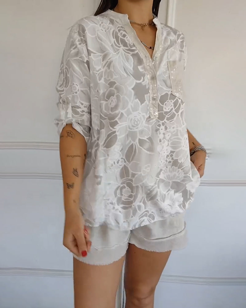 Kélya | Chemisier ample à motif fleuri avec détails pailletés